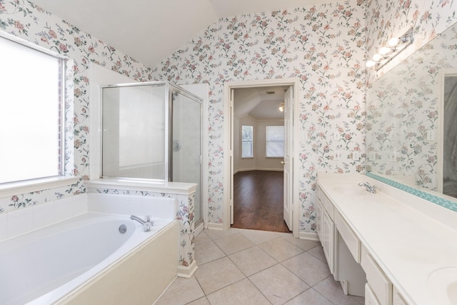 full bathroom with a stall shower, a sink, and wallpapered walls