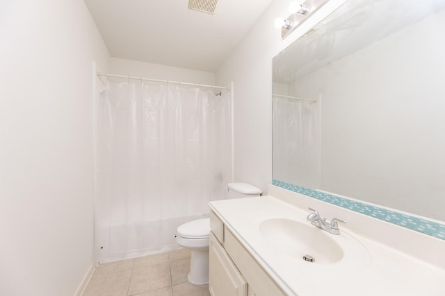 bathroom featuring toilet, vanity, visible vents, tile patterned floors, and shower / bathtub combination with curtain