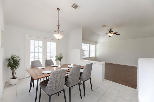 dining space featuring french doors, visible vents, and light tile patterned floors