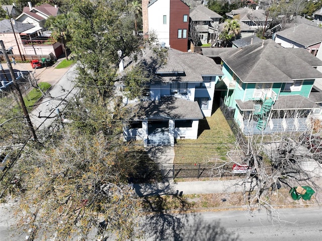 birds eye view of property with a residential view