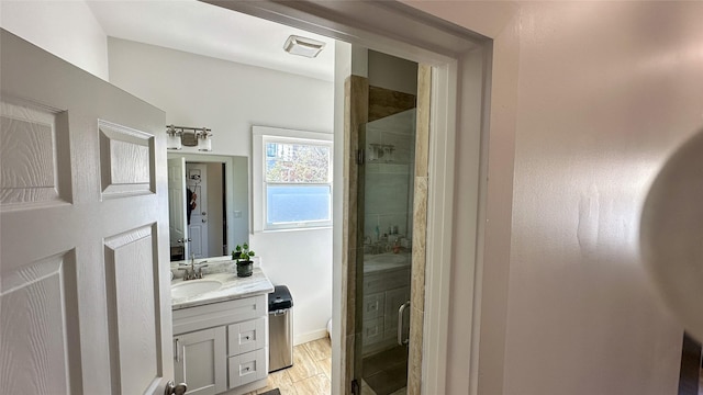 bathroom featuring toilet, visible vents, a shower stall, and vanity