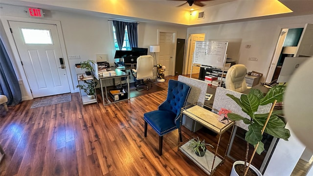 interior space featuring hardwood / wood-style flooring, ceiling fan, and visible vents