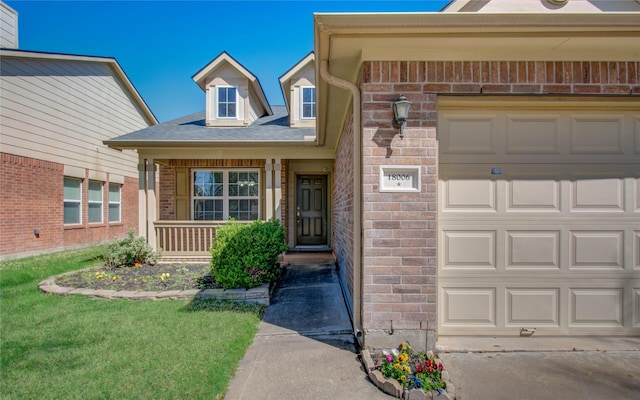 doorway to property featuring an attached garage, stone siding, a porch, and brick siding