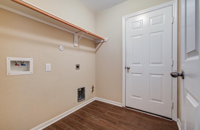 clothes washing area featuring hookup for a washing machine, wood tiled floor, hookup for an electric dryer, gas dryer hookup, and laundry area