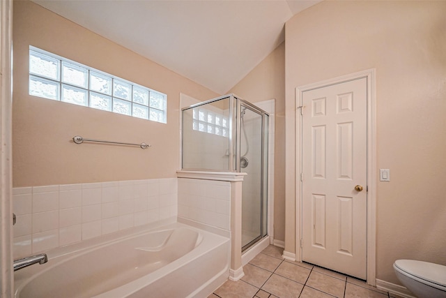 bathroom featuring a garden tub, toilet, a stall shower, tile patterned flooring, and lofted ceiling