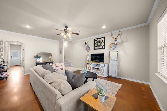 living area with stairway, baseboards, arched walkways, and ornamental molding