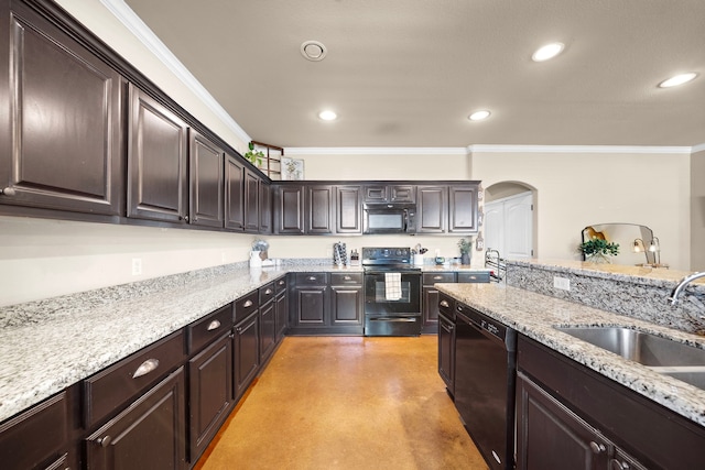 kitchen featuring crown molding, black appliances, a sink, and recessed lighting