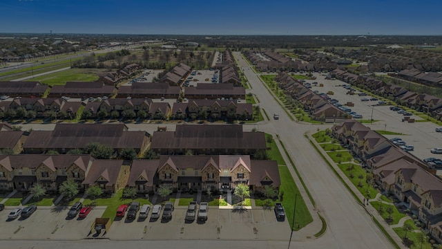 birds eye view of property with a residential view