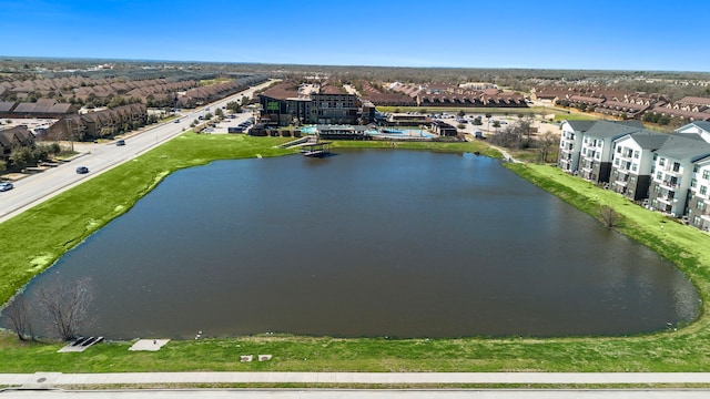 aerial view featuring a residential view and a water view