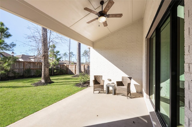 view of patio with a ceiling fan and a fenced backyard