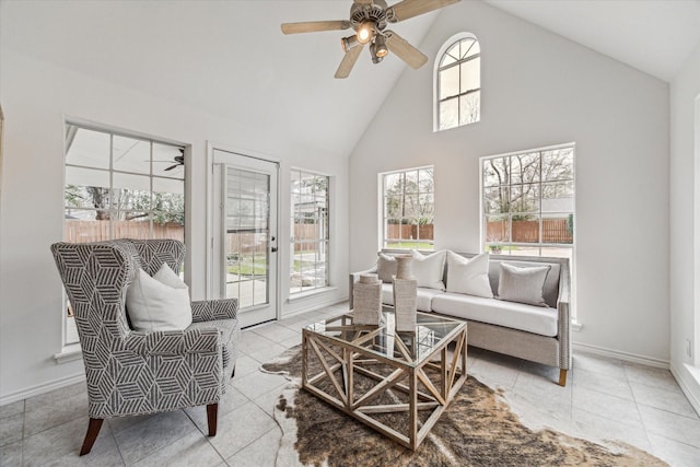 sunroom / solarium with lofted ceiling and ceiling fan