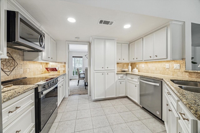 kitchen featuring white cabinetry, light tile patterned flooring, visible vents, and appliances with stainless steel finishes