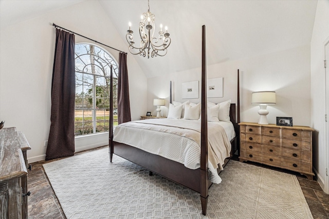 bedroom featuring lofted ceiling, a notable chandelier, and baseboards