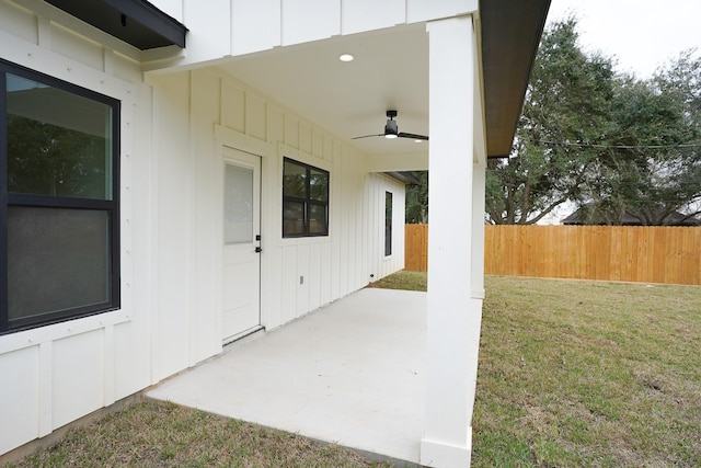 view of patio / terrace with fence and a ceiling fan