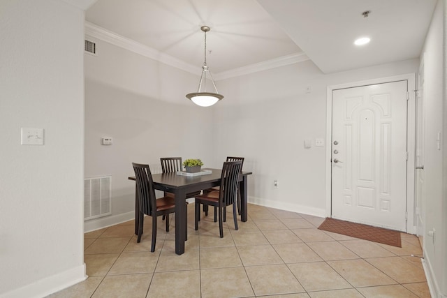 dining room with ornamental molding, light tile patterned flooring, and visible vents