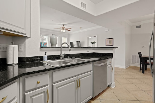 kitchen with light tile patterned floors, a sink, visible vents, dishwasher, and crown molding