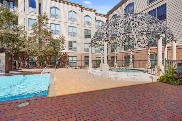 view of pool with fence