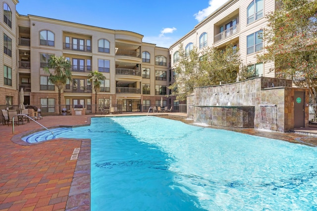 pool featuring a patio area