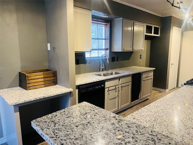 kitchen with light stone counters, light wood-style flooring, a sink, black dishwasher, and crown molding