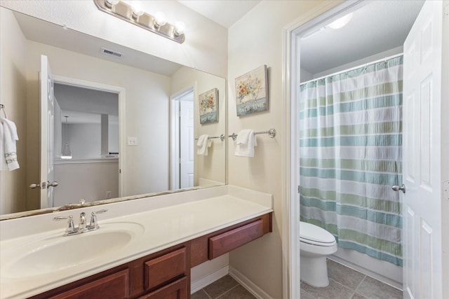 full bathroom featuring toilet, vanity, visible vents, and tile patterned floors