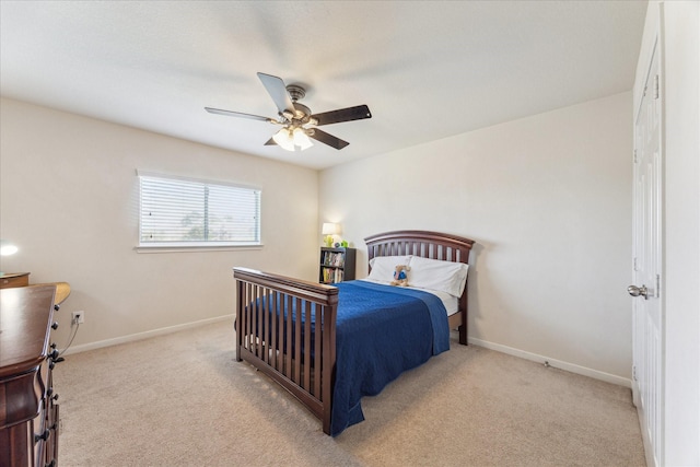 carpeted bedroom featuring a ceiling fan and baseboards