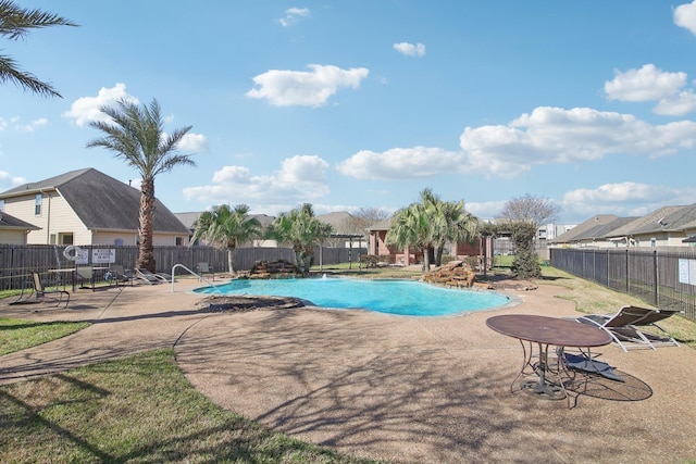 pool featuring a patio area and fence