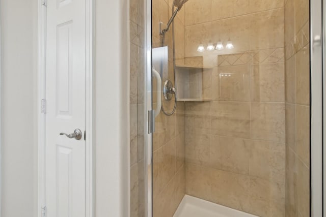 full bath with a shower stall