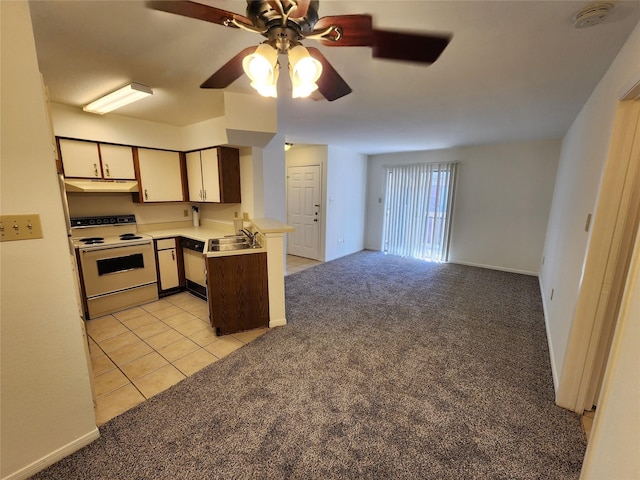 kitchen featuring white electric stove, under cabinet range hood, light colored carpet, a peninsula, and open floor plan