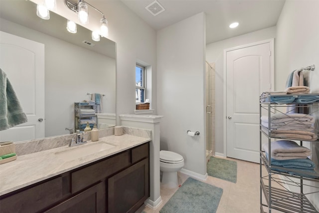 bathroom featuring toilet, a stall shower, vanity, and visible vents