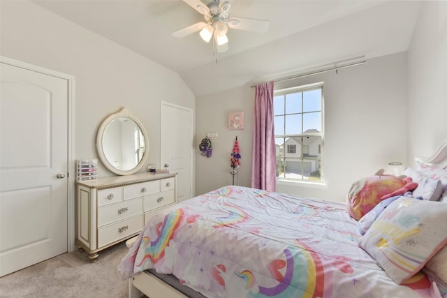 bedroom featuring light carpet, ceiling fan, and vaulted ceiling