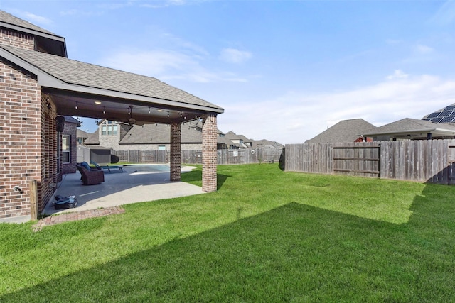 view of yard with a patio area and a fenced backyard