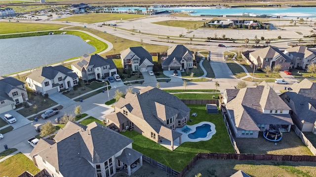 aerial view with a water view and a residential view