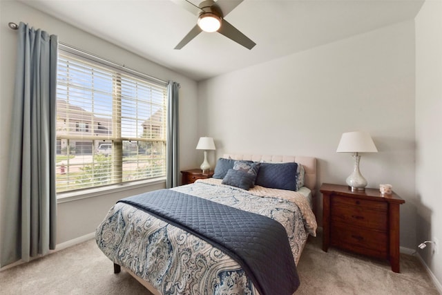 bedroom featuring carpet flooring, a ceiling fan, and baseboards