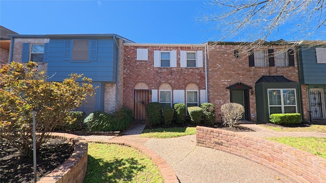 multi unit property featuring brick siding