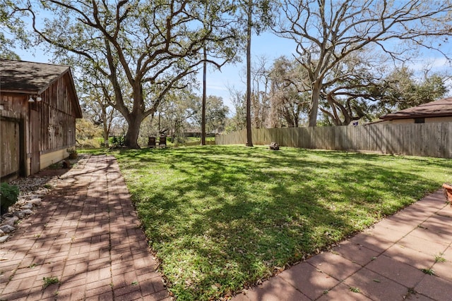 view of yard with a fenced backyard