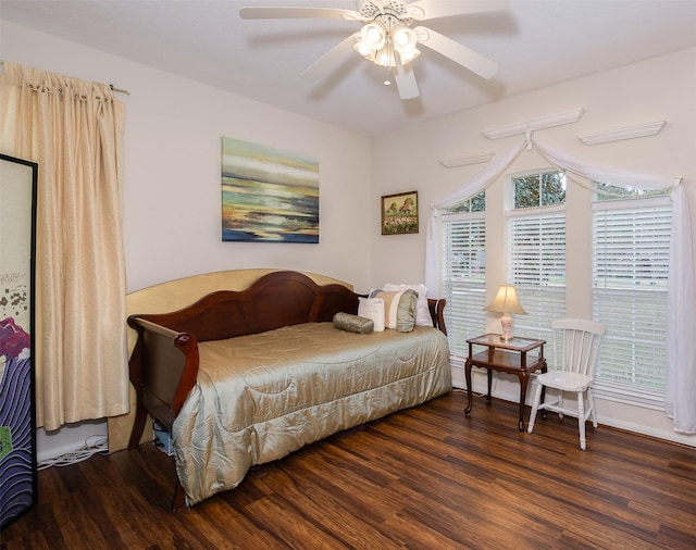 bedroom featuring a ceiling fan and wood finished floors