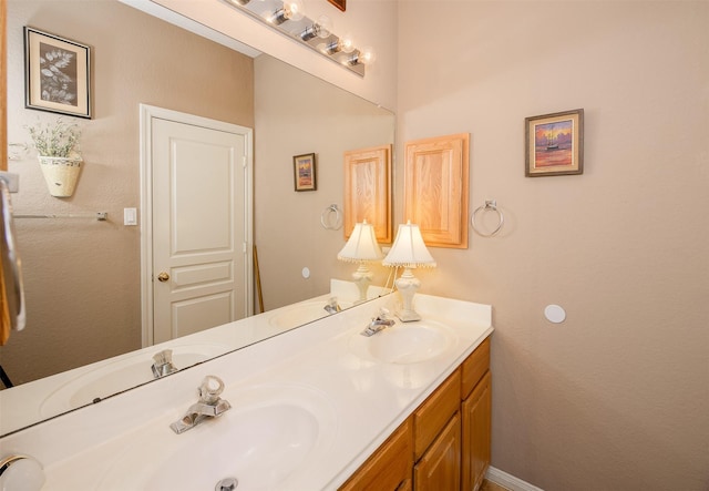 bathroom with double vanity and a sink