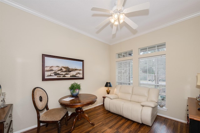 living area featuring baseboards, wood finished floors, a ceiling fan, and crown molding