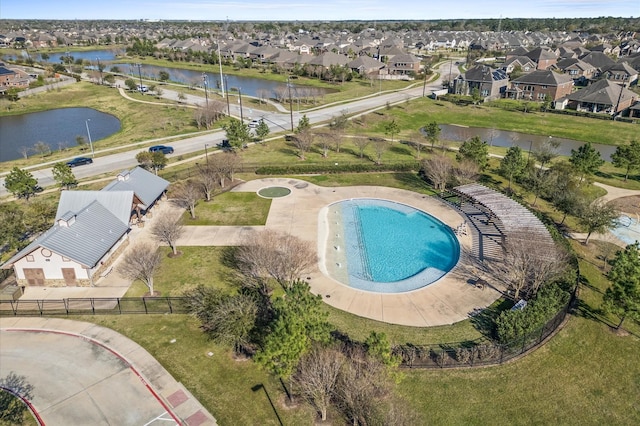 bird's eye view featuring a residential view and a water view