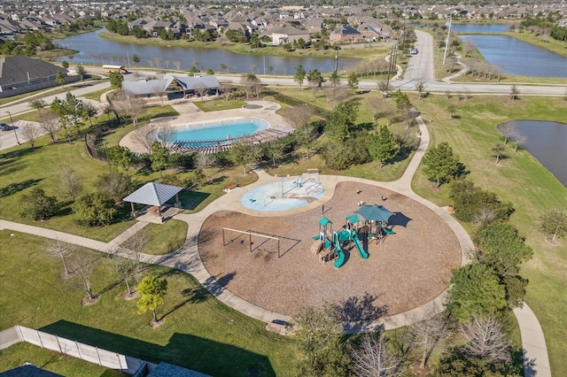 bird's eye view featuring a water view and a residential view