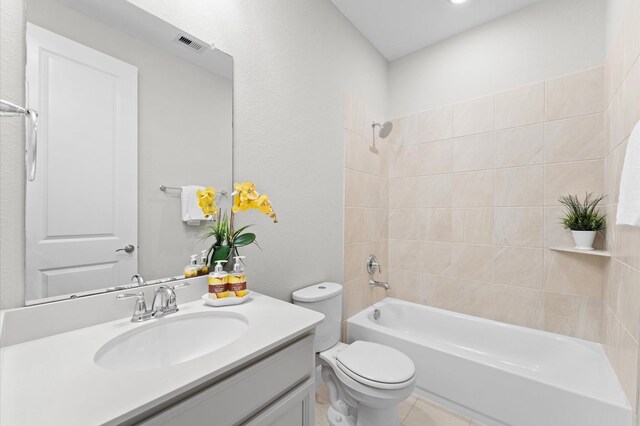 bathroom featuring toilet, vanity, visible vents, and shower / bathtub combination