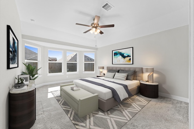 bedroom featuring baseboards, visible vents, ceiling fan, and carpet flooring