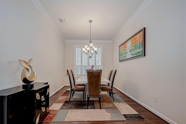 dining area featuring baseboards, crown molding, visible vents, and dark wood-type flooring