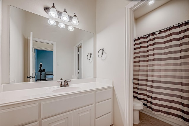 full bath featuring curtained shower, vanity, toilet, and tile patterned floors