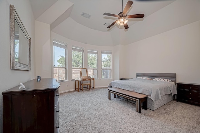 bedroom with a ceiling fan, light colored carpet, visible vents, and baseboards