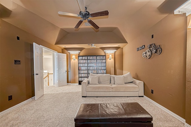 living area with vaulted ceiling, carpet flooring, a ceiling fan, and baseboards