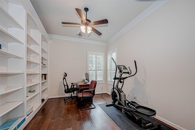 exercise room with crown molding, dark wood finished floors, baseboards, and a ceiling fan