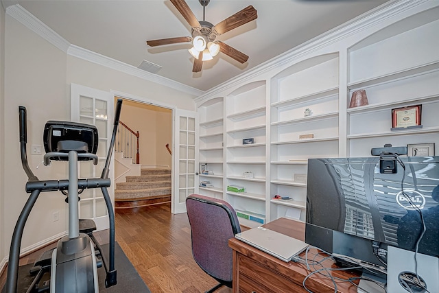 office area with ornamental molding, visible vents, ceiling fan, and wood finished floors