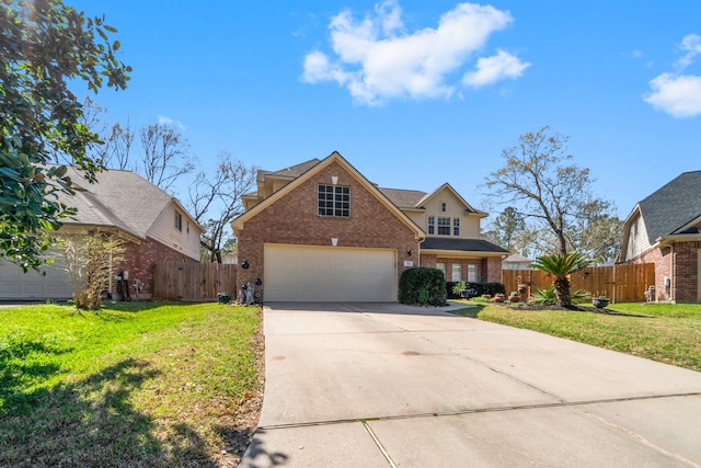 traditional home with a front lawn, fence, brick siding, and driveway