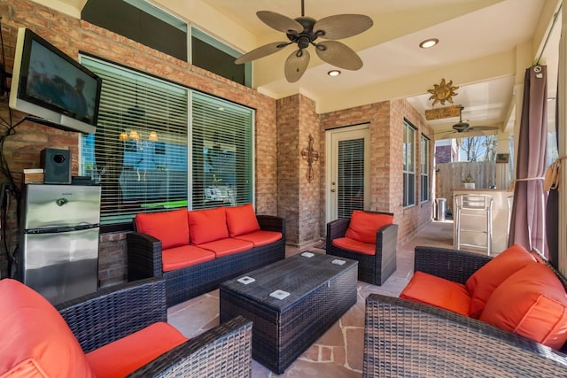 view of patio / terrace with an outdoor living space and ceiling fan